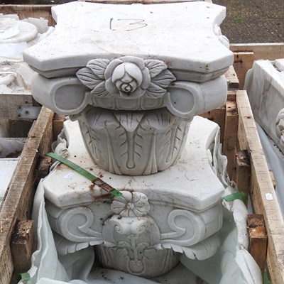 Lot 663 - A pair of carved marble capitals