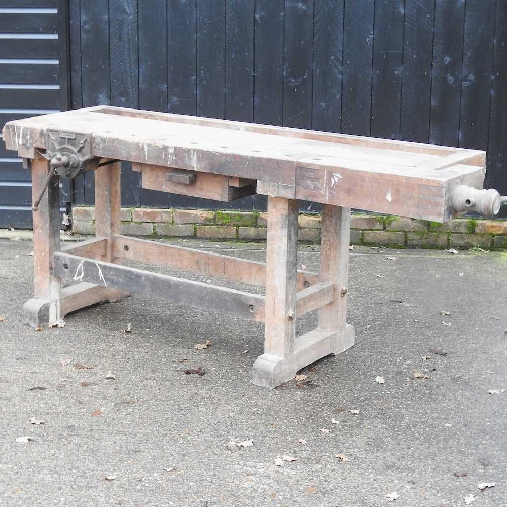 Lot 338 - A wooden work bench