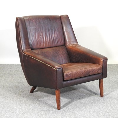 Lot 627 - A mid 20th century brown leather upholstered armchair