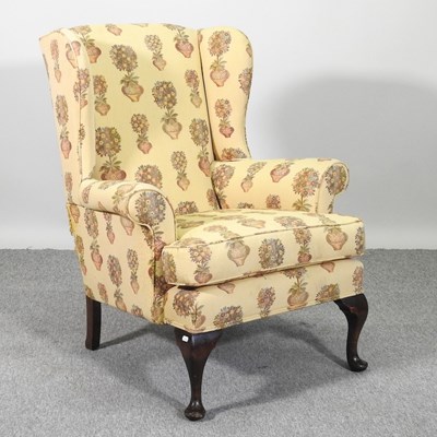 Lot 536 - A 1920's wingback armchair