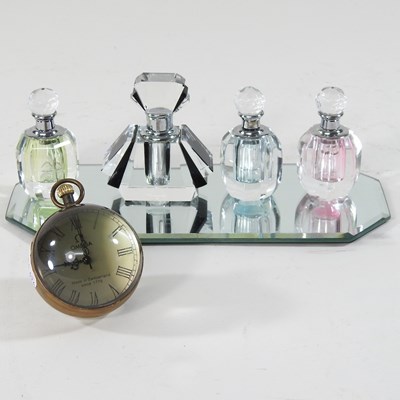 Lot 28 - A set of three glass scent bottles
