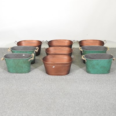 Lot 419 - A set of four copper coloured metal planters