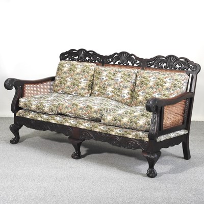 Lot 497 - A carved hardwood three piece bergere suite