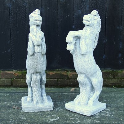 Lot 322 - A pair of reconstituted stone horses