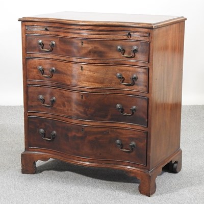 Lot 552 - An Edwardian serpentine chest