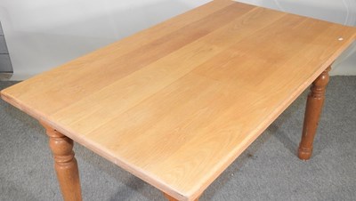 Lot 388 - A modern light oak dining table