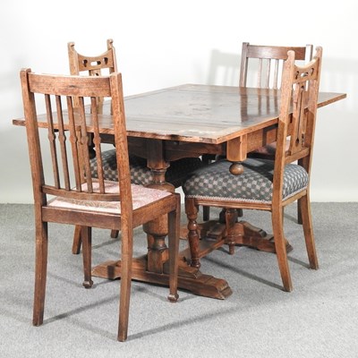 Lot 571 - A 1930's oak leaf dining table