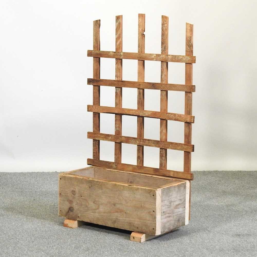 Lot 327 - A small garden planter with trellis