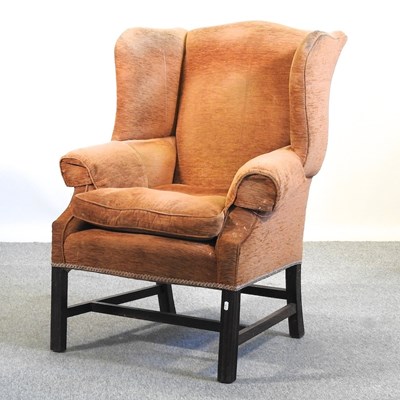 Lot 452 - A George III style wing armchair