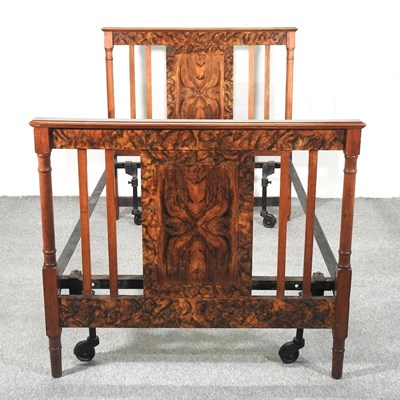 Lot 490 - An Edwardian simulated walnut double bedstead