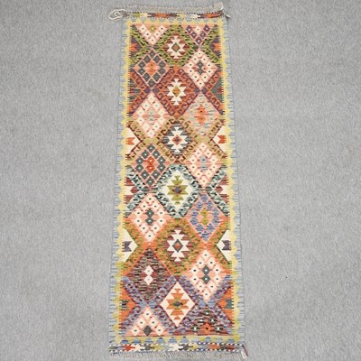 Lot 205 - A kelim runner
