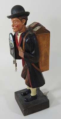 Lot 17 - A Swiss carved and painted figural clock