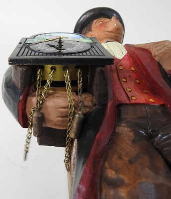 Lot 17 - A Swiss carved and painted figural clock