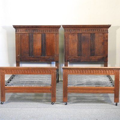 Lot 466 - A pair of early 20th century carved oak single bedsteads