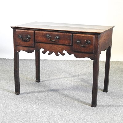 Lot 448 - An 18th century oak lowboy