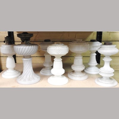 Lot 197 - A collection of seven glass lamp bases
