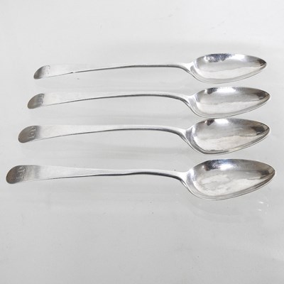 Lot 51 - A collection of four Old English pattern silver teaspoons