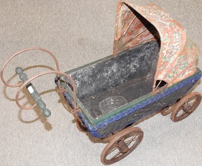 Lot 395 - A vintage doll's pram