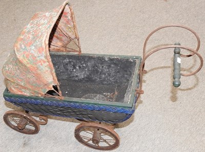 Lot 395 - A vintage doll's pram