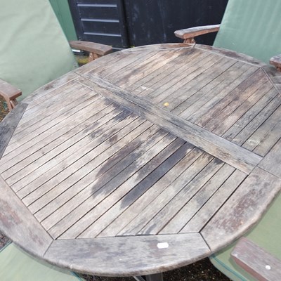 Lot 14 - A teak circular garden table