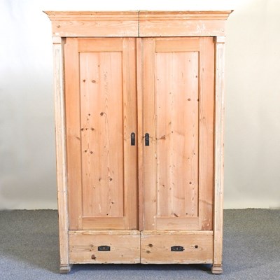 Lot 391 - An early 20th century continental pine armoire