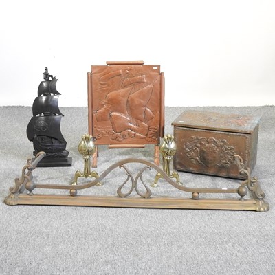 Lot 404 - An Art Deco cast iron companion set