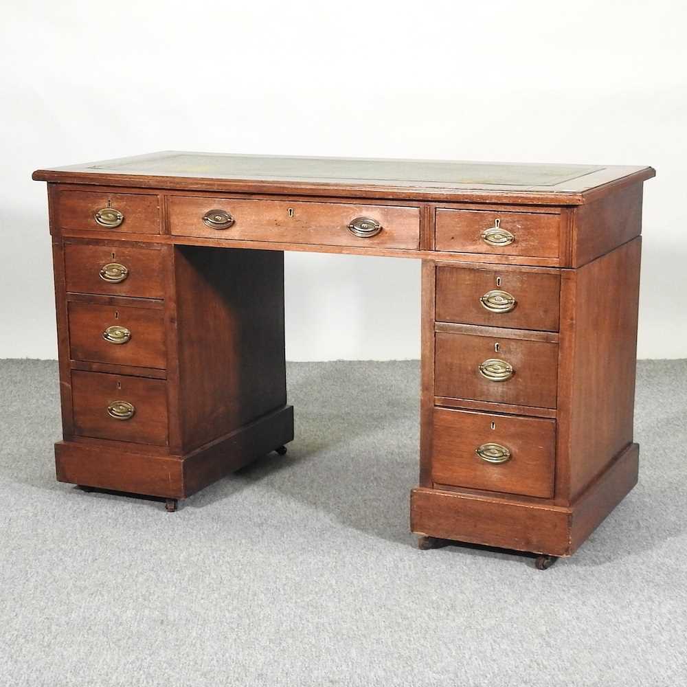 Lot 460 - A Edwardian walnut pedestal desk