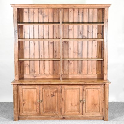 Lot 416 - A pine cabinet bookcase