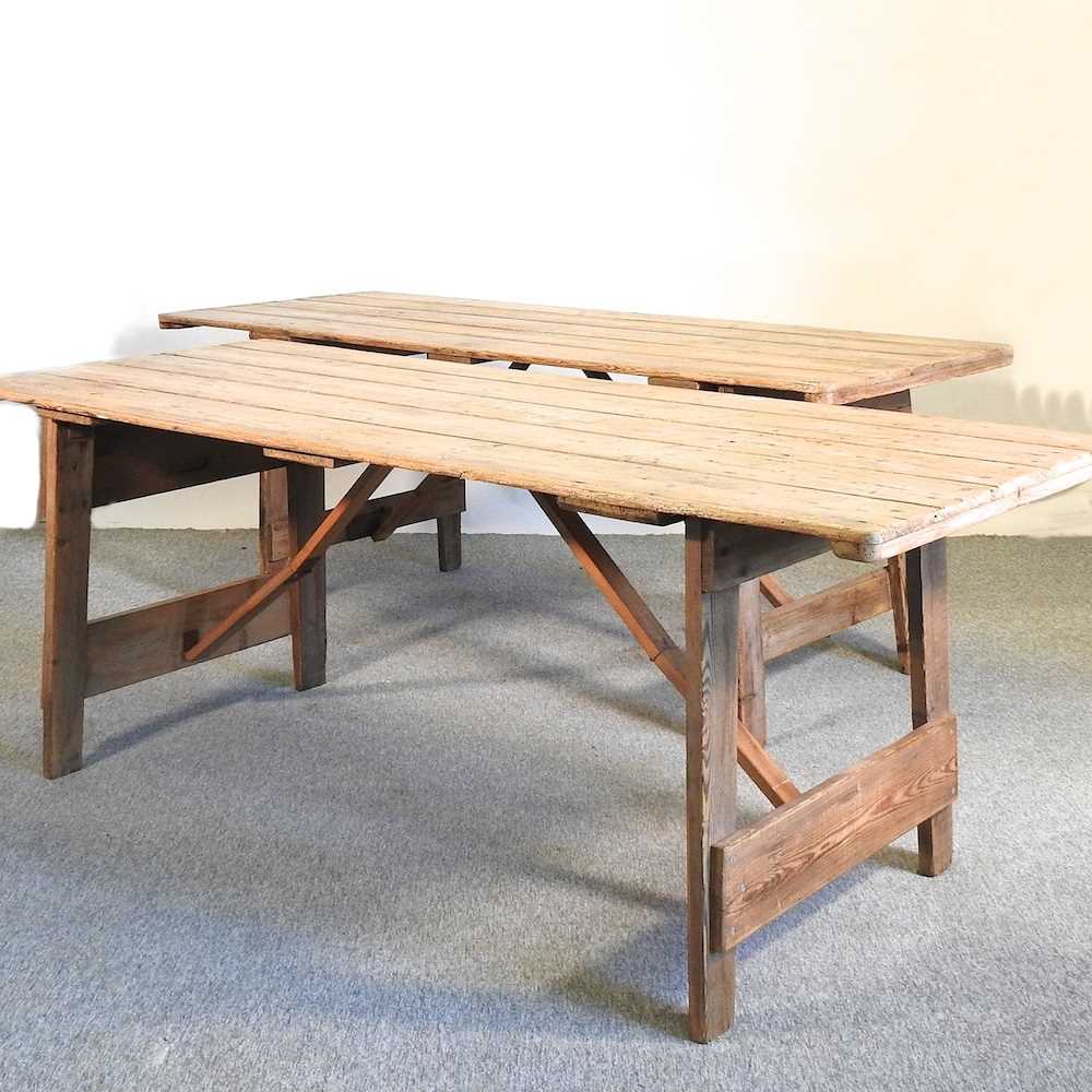 Lot 358 A folding wooden trestle table