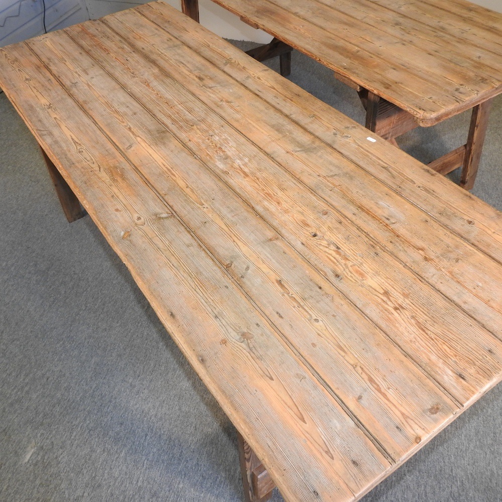 Lot 358 A folding wooden trestle table