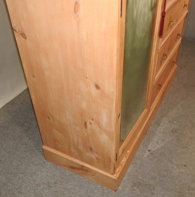 Lot 63 - An Edwardian stripped pine combination wardrobe