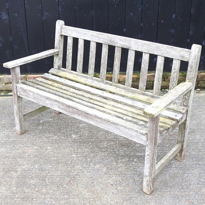 Lot 319 - A hardwood slatted garden bench