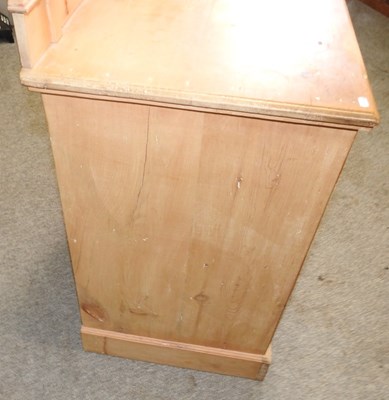Lot 69 - An Edwardian stripped pine dressing chest