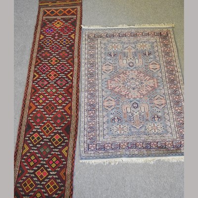 Lot 229 - A kelim runner