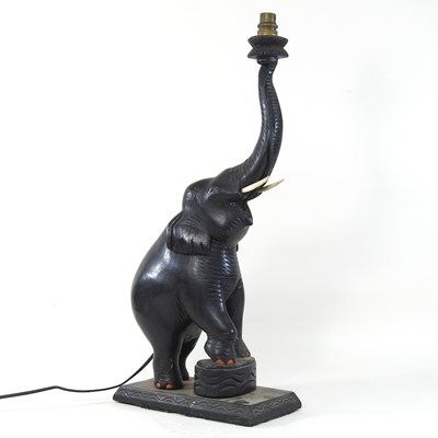 Lot 197 - An early 20th century carved wooden table lamp