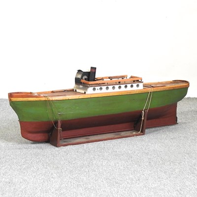 Lot 546 - A wooden model boat