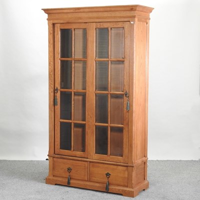 Lot 534 - A modern light oak glazed cabinet