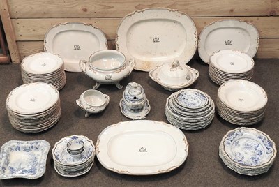 Lot 177 - A 19th century extensive white glazed part dinner service, each piece bearing a family crest