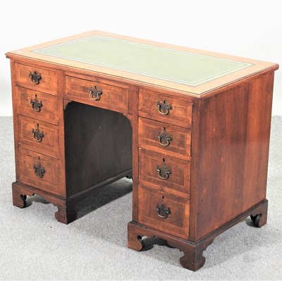 Lot 469 - An early 20th century walnut and cross banded pedestal desk