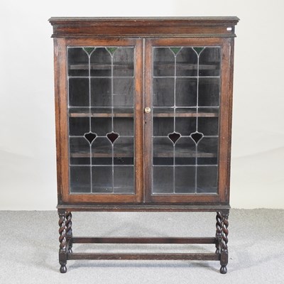 Lot 517 - A 1920's oak display cabinet