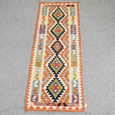 Lot 407 - A kelim runner