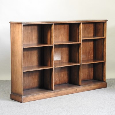 Lot 664 - An oak dwarf open bookcase