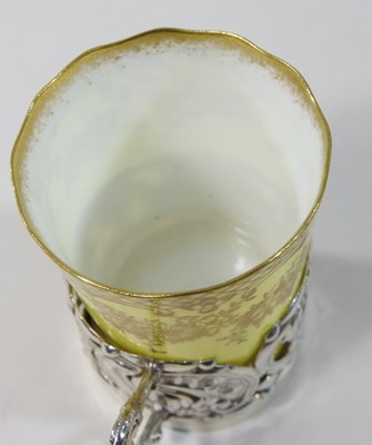 Lot 14 - An Edwardian silver mounted yellow glazed porcelain coffee set