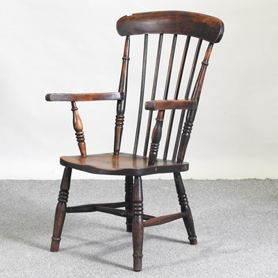 Lot 685 - A stick back armchair