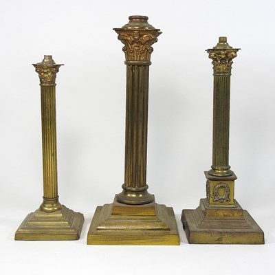 Lot 316 - Three brass lamp bases