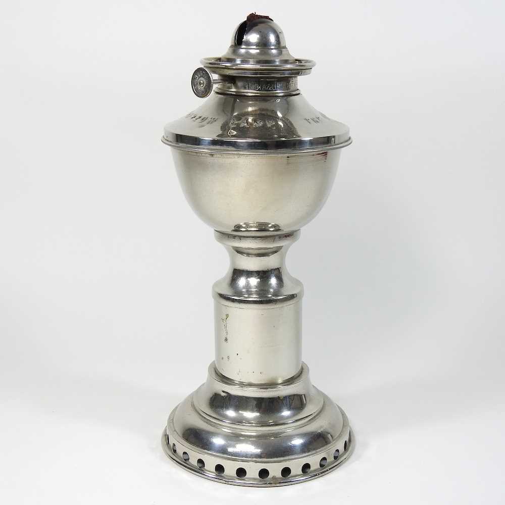 Lot 175 A clockwork oil lamp