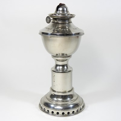 Lot 175 - A clockwork oil lamp