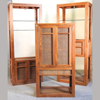 Lot 565 - An American oak shelving unit