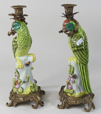 Lot 13 - A pair of continental porcelain candlesticks