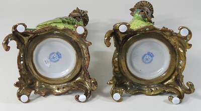 Lot 13 - A pair of continental porcelain candlesticks